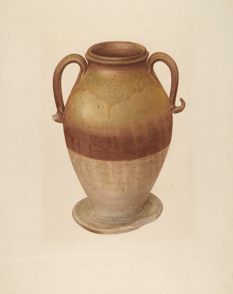 The image shows a large ceramic vase with two curved handles positioned near the top on either side. The vase has an earthy color palette with shades of brown, beige, and a subtle hint of reddish-brown forming a band around its middle. The vase is centrally placed on a flat surface, and both handles extend outward at the top.
