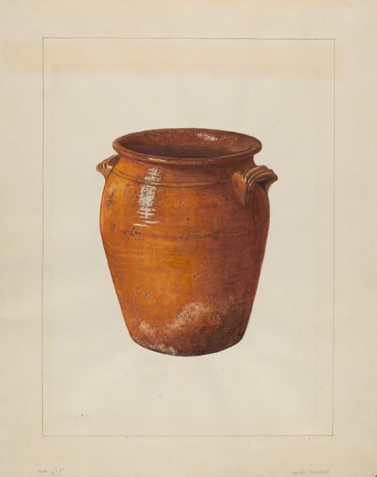 The image features a large terracotta pot with two small handles on its sides. The pot is primarily in shades of earthy orange and brown with some lighter patches that suggest a slightly weathered texture. It is positioned centrally against a plain, light background.