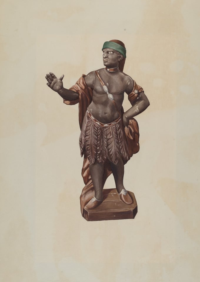 The sculpture depicts a male figure standing upright with one hand raised and the other resting on his hip. The subject is wearing a garment that drapes over one shoulder and a feather-patterned skirt, accessorized with a headband. The colors of the sculpture are predominantly earth tones, including browns and a green headband. The material appears to be a type of stone or ceramic with a polished finish. The figure is slightly larger than everyday objects, allowing viewers to appreciate the intricacies of the carving and the details in the drapery and texture. The statue stands on a rectangular base that is consistent with the overall color palette.
