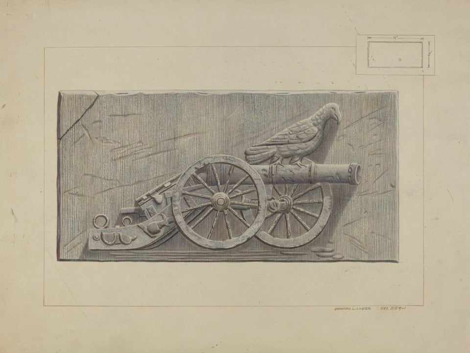 This image shows an engraved design featuring a cannon with large wheels next to an eagle perched on top, situated on the left side of a rectangular stone slab. The color scheme is predominantly grayscale with subtle hints of blue and gray tones throughout the stone surface. The cannon is positioned slightly to the left in the composition, with its barrel pointing to the right, while the eagle is perched on the cannon barrel facing forward, wings tucked close to its body. To accompany the cannon, a stack of cannonballs is carved on the lower left, further anchoring the scene within the carved rectangle.