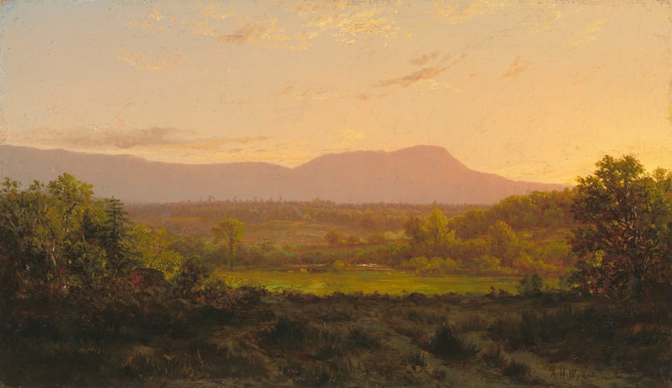 The painting depicts a rural landscape at sunset or sunrise. The horizon is slightly above the center, showing distant pale-pink and purple mountains against the sky. Closest to us is an area with dark green bushes and vegetation, leading to a lighter green field surrounded by green-and-brown trees. The palette is warm and earthy, with greens and browns in the bottom transitioning to purples and pinks in the distance. The sky is a pale-yellow color that fades into light blue towards the top left corner, and faint yellow and gray clouds drift across it.