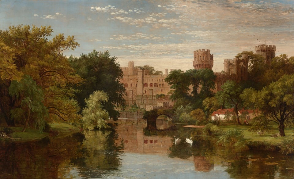 This painting features a landscape with a calm body of water dominating the lower portion. The view is slightly elevated, overlooking the water that reflects the surrounding greenery and sky. Two white swans glide on the river, which is surrounded by green trees and shrubs. In the distance, a large tan castle with multiple towers and crenellations stands above the trees. In front of the castle, on the right side of the painting, a smaller structure with white walls and red roofs sits, surrounded by greenery. One or two people appear to sit out in front of it, and on the right sheep lay in the soft green grass. The color palette includes deep greens, soft browns, and varying shades of blue.
