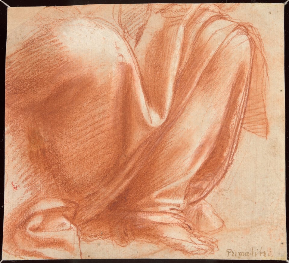 A work made of red chalk and brush and red chalk wash (recto) and black chalk, with black chalk grid lines, (verso) on cream laid paper.