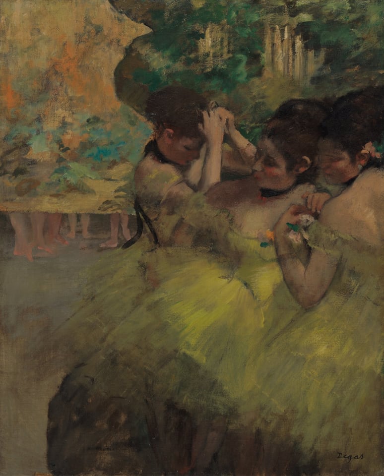 Three light-skinned, dark-haired ballerinas, painted in muted tones, wear off-the-shoulder yellow leotards and tutus as they huddle near each other. One adjusts her costume, while one holds her hands clasped above her head. At left is a painted screen with four pairs of feet visible underneath.